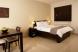 One room suite with a queen bed